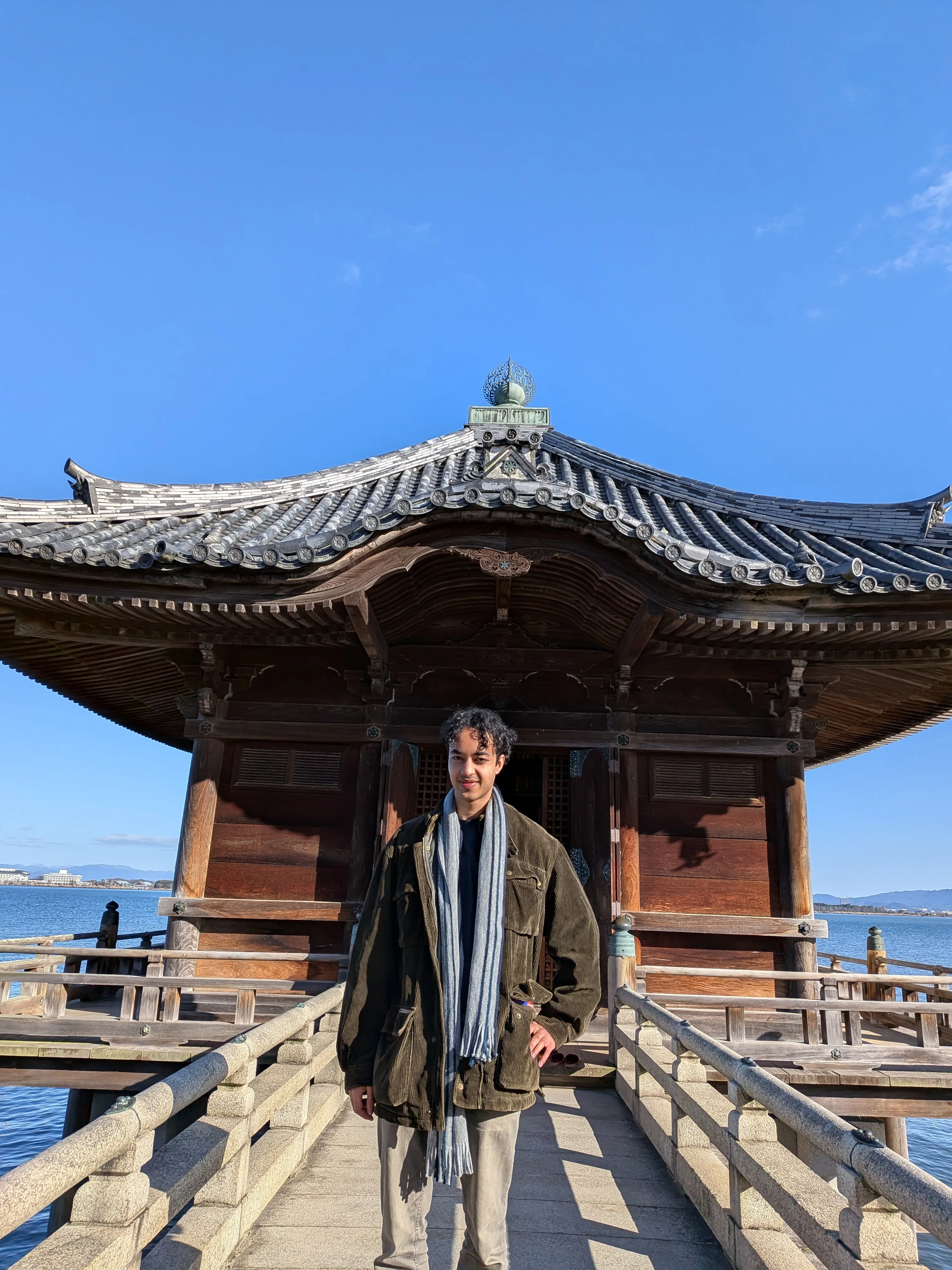 Tyrone White standing on the bridge to Ukimidō, a temple on Lake Biwa.